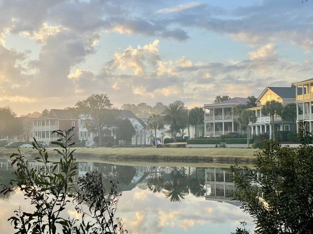 Homes reflected in a pond at sunset in Mount Pleasant