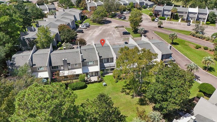 Close aerial view of the home and its building